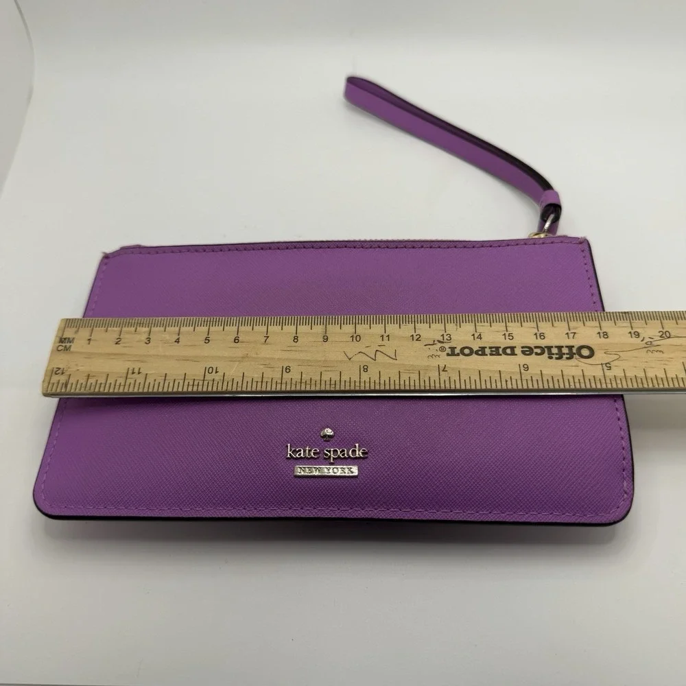 Kate Spade New York purple leather wristlet.
